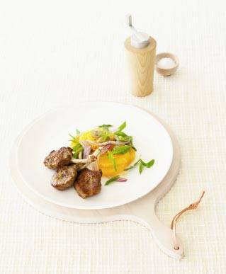 Lamb cutlets with orange, onion and olive salad
