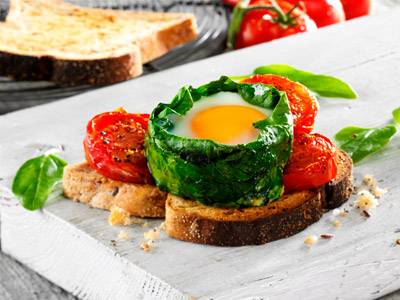 Spinach Eggs, roasted balsamic tomatoes with PureBred Multigrain Farmhouse Toast